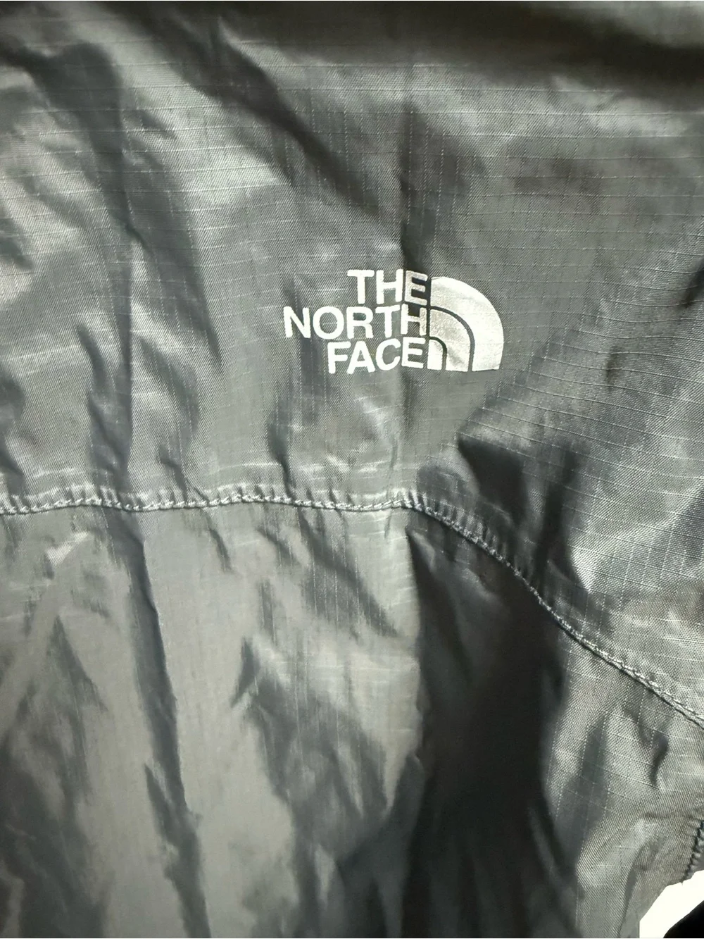 The North Face Kids Black Raincoat with Neon Green Lining